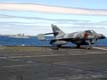 Au premier plan : Super Etendard sur le pont du Charles de Gaulle au mouillage à Saint-Pierre et Miquelon et au second plan la frégate britannique HMS Nottingham.  (©Marine Nationale)